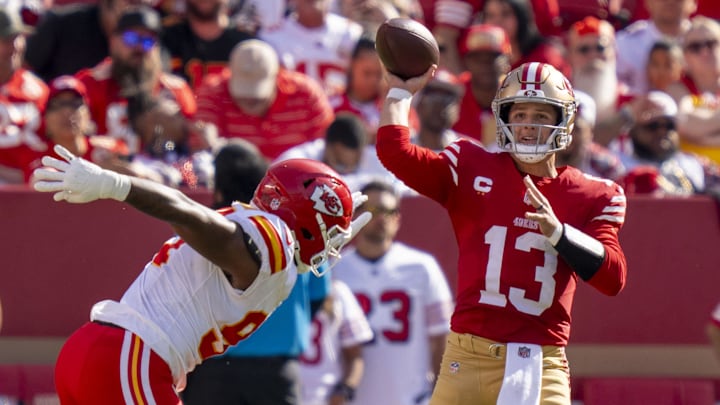 October 20, 2024; Santa Clara, California, USA; San Francisco 49ers quarterback Brock Purdy (13) passes the football against Kansas City Chiefs defensive end Malik Herring (94) during the second quarter at Levi's Stadium. Mandatory Credit: Kyle Terada-Imagn Images