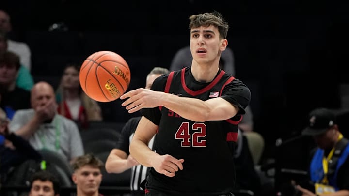 Mar 13, 2025; Charlotte, NC, USA; Stanford Cardinal forward Maxime Raynaud (42) passes the ball in the first half at Spectrum Center. Mandatory Credit: Bob Donnan-Imagn Images