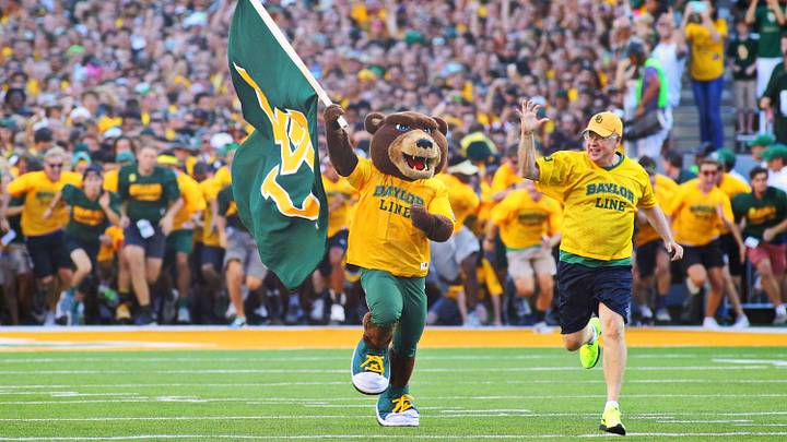 Sep 12, 2015; Waco, TX, USA; The Baylor Bear and president Ken Starr lead the "Baylor Line" unto the field prior to a game against the Lamar Cardinals at McLane Stadium. Baylor won 66-31. Mandatory Credit: Ray Carlin-USA TODAY Sports Sep 12, 2015; Waco, TX, USA; The Baylor Bear and president Ken Starr lead the "Baylor Line" unto the field prior to a game against the Lamar Cardinals at McLane Stadium. Baylor won 66-31. Mandatory Credit: Ray Carlin-USA TODAY Sports