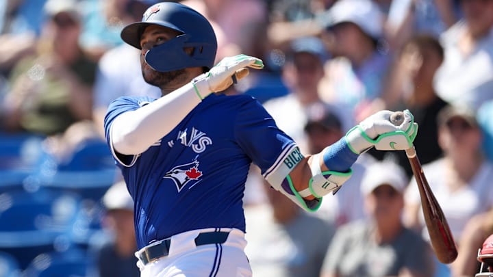 Mar 2, 2025; Dunedin, Florida, USA; Toronto Blue Jays shortstop Bo Bichette (11) hits a home run against the Philadelphia Phillies in the third inning during spring training at TD Ballpark. Mar 2, 2025; Dunedin, Florida, USA; Toronto Blue Jays shortstop Bo Bichette (11) hits a home run against the Philadelphia Phillies in the third inning during spring training at TD Ballpark.