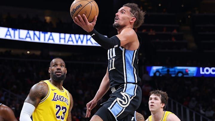 Atlanta Hawks guard Trae Young, Los Angeles Lakers forward LeBron James and guard Austin Reaves.
