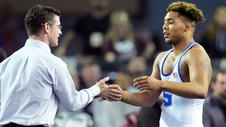 Stillwater's Ladarion Lockett celebrates his win over Mustang's Daegan Reyes in the Class 6A boys 175-pound match during the Oklahoma State high high school wrestling championship tournament at the State Fair Arena in Oklahoma City, Saturday, March, 1, 2025. Stillwater's Ladarion Lockett celebrates his win over Mustang's Daegan Reyes in the Class 6A boys 175-pound match during the Oklahoma State high high school wrestling championship tournament at the State Fair Arena in Oklahoma City, Saturday, March, 1, 2025.