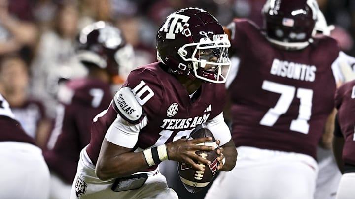 Nov 30, 2024; College Station, Texas, USA; Texas A&M Aggies quarterback Marcel Reed (10) runs the ball during the first half against the Texas Longhorns. The Longhorns defeated the Aggies 17-7 at Kyle Field. Mandatory Credit: Maria Lysaker-Imagn Images Nov 30, 2024; College Station, Texas, USA; Texas A&M Aggies quarterback Marcel Reed (10) runs the ball during the first half against the Texas Longhorns. The Longhorns defeated the Aggies 17-7 at Kyle Field. Mandatory Credit: Maria Lysaker-Imagn Images