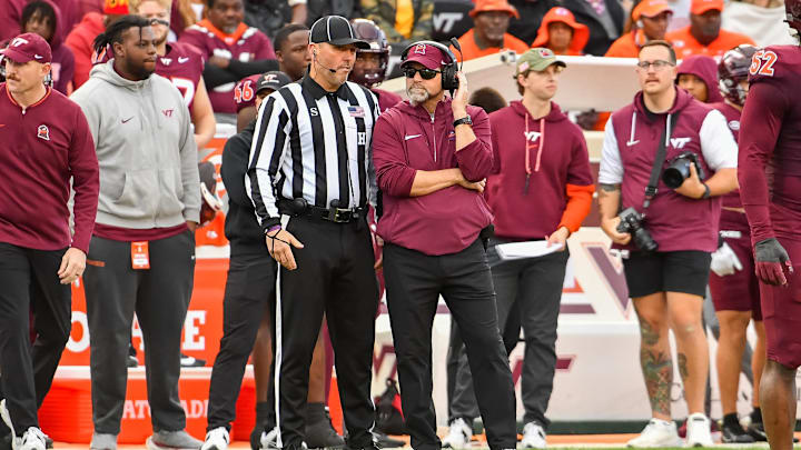 Nov 9, 2024; Blacksburg, Virginia, USA;  Virginia Tech Hokies head coach Brent Pry talks to an official during the second quarter against the Clemson Tigers at Lane Stadium. Mandatory Credit: Brian Bishop-Imagn Images