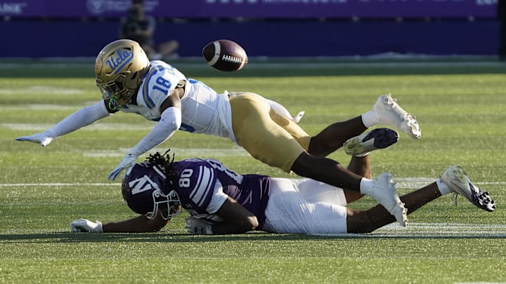 Sep 27, 2025; Evanston, Illinois, USA; UCLA Bruins defensive back Rodrick Pleasant (18) defends Northwestern Wildcats wide receiver Hayden Eligon II (80) during the second half at Northwestern Medicine Field at Martin Stadium. Mandatory Credit: David Banks-Imagn Images