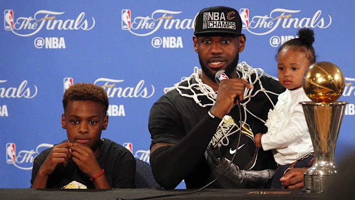 June 19, 2016; Oakland, CA, USA; Cleveland Cavaliers forward LeBron James (23) speaks to media with his children LeBron James Jr. and daughter Zhuri James following the 93-89 victory against the Golden State Warriors in game seven of the NBA Finals at Oracle Arena. Mandatory Credit: Cary Edmondson-Imagn Images