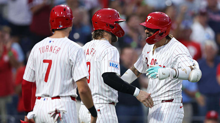 Aug 27, 2024; Philadelphia, Pennsylvania, USA; Philadelphia Phillies outfielder Nick Castellanos (8) celebrates with first base Bryce Harper (3) and shortstop Trea Turner (7) after hitting a three RBI home run against the Houston Astros during the third inning at Citizens Bank Park.