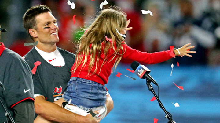 Feb 7, 2021; Tampa, FL, USA; Tampa Bay Buccaneers quarterback Tom Brady (12) celebrates with his daughter Vivian after the Tampa Bay Buccaneers beat the Kansas City Chiefs in Super Bowl LV at Raymond James Stadium. Feb 7, 2021; Tampa, FL, USA; Tampa Bay Buccaneers quarterback Tom Brady (12) celebrates with his daughter Vivian after the Tampa Bay Buccaneers beat the Kansas City Chiefs in Super Bowl LV at Raymond James Stadium.