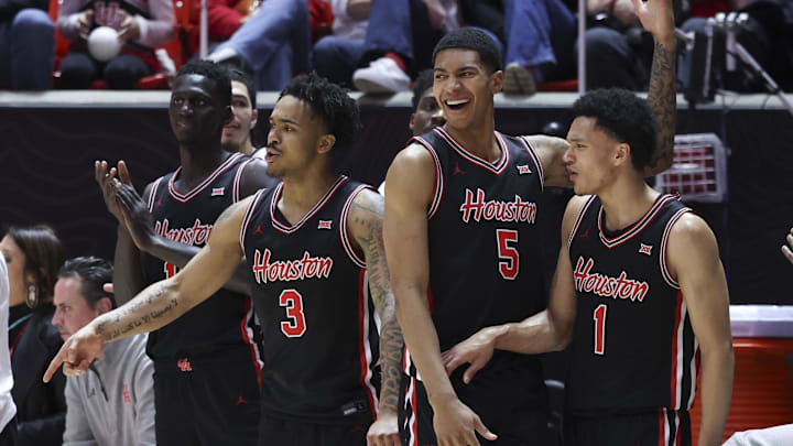 Players on the Houston Cougars bench react after a play against the Utah Utes. Players on the Houston Cougars bench react after a play against the Utah Utes.