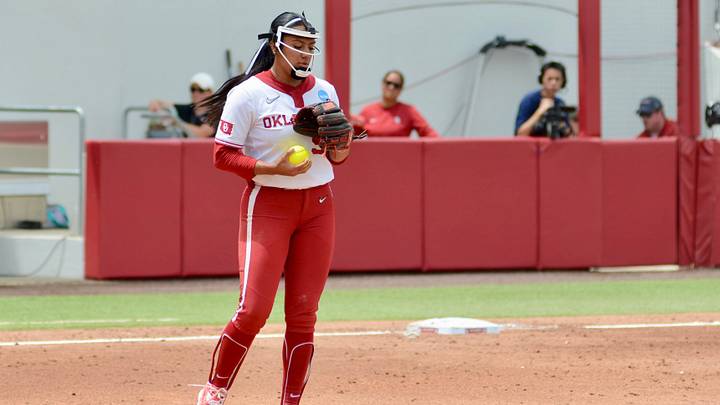 Oklahoma pitcher Miali Guachino heads out to the circle between innings in Game 1 of the Norman Super Regional.