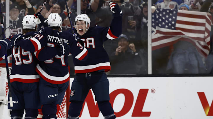 Feb 20, 2025; Boston, MA, USA; [Imagn Images direct customers only]  Team USA forward Brady Tkachuk (7) and forward Auston Matthews (34) celebrate defenseman Jake Sanderson (85) goal against Team Canada during the second period during the 4 Nations Face-Off ice hockey championship game at TD Garden. Mandatory Credit: Winslow Townson-Imagn Images