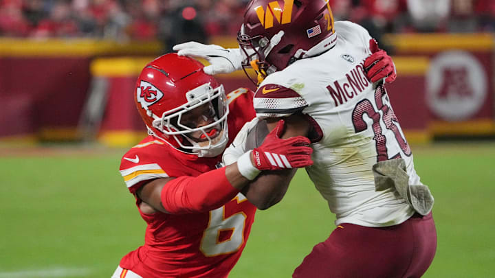 Oct 27, 2025; Kansas City, Missouri, USA; Kansas City Chiefs safety Bryan Cook (6) tackles Washington Commanders running back Jeremy McNichols (26) during the third quarter of the game at GEHA Field at Arrowhead Stadium. Mandatory Credit: Denny Medley-Imagn Images