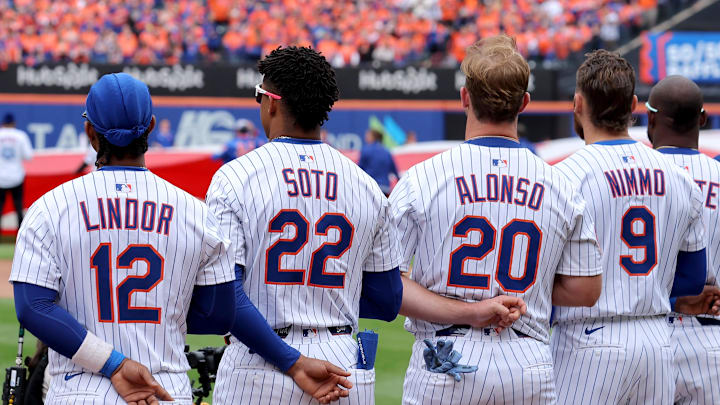 Apr 4, 2025; New York City, New York, USA; New York Mets shortstop Francisco Lindor (12) and right fielder Juan Soto (22) and first baseman Pete Alonso (20) and left fielder Brandon Nimmo (9) stand for the national anthem before the Mets home opener against the Toronto Blue Jays at Citi Field.