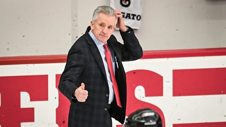 Wisconsin Badgers head coach Mark Johnson acknowledges an official after an 11-0 victory against the Bemidji State Beavers in a WCHA first-round game Saturday, March 1, 2025, at LaBahn Arena in Madison, Wisconsin.