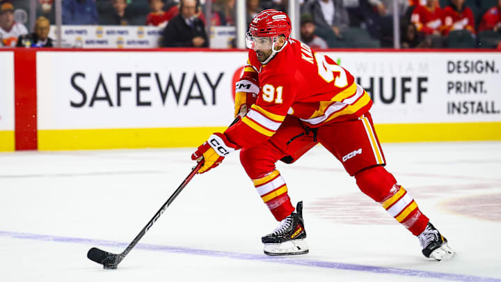 Oct 3, 2025; Calgary, Alberta, CAN; Calgary Flames center Nazem Kadri (91) controls the puck against the Winnipeg Jets during the overtime period at Scotiabank Saddledome. Mandatory Credit: Sergei Belski-Imagn Images Oct 3, 2025; Calgary, Alberta, CAN; Calgary Flames center Nazem Kadri (91) controls the puck against the Winnipeg Jets during the overtime period at Scotiabank Saddledome. Mandatory Credit: Sergei Belski-Imagn Images