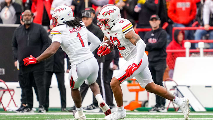 Maryland Terrapins defensive back Dante Trader Jr. (12) runs after getting an interception against the Nebraska Cornhuskers during the first quarter at Memorial Stadium in a 2023 game. Maryland Terrapins defensive back Dante Trader Jr. (12) runs after getting an interception against the Nebraska Cornhuskers during the first quarter at Memorial Stadium in a 2023 game.