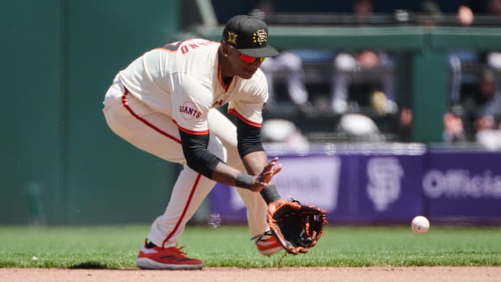 May 19, 2024; San Francisco, California, USA; San Francisco Giants infielder Marco Luciano (37) fields a ground ball against the Colorado Rockies during the fourth inning at Oracle Park. 