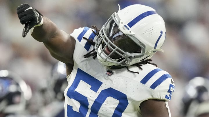Dec 22, 2024; Indianapolis, Indiana, USA; Indianapolis Colts linebacker Segun Olubi (50) celebrates a stop during a game against the Tennessee Titans at Lucas Oil Stadium.