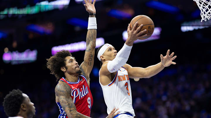 Nov 12, 2024; Philadelphia, Pennsylvania, USA; New York Knicks guard Josh Hart (3) drives for a shot in front of Philadelphia 76ers guard Kelly Oubre Jr. (9) during the second quarter at Wells Fargo Center. Mandatory Credit: Bill Streicher-Imagn Images