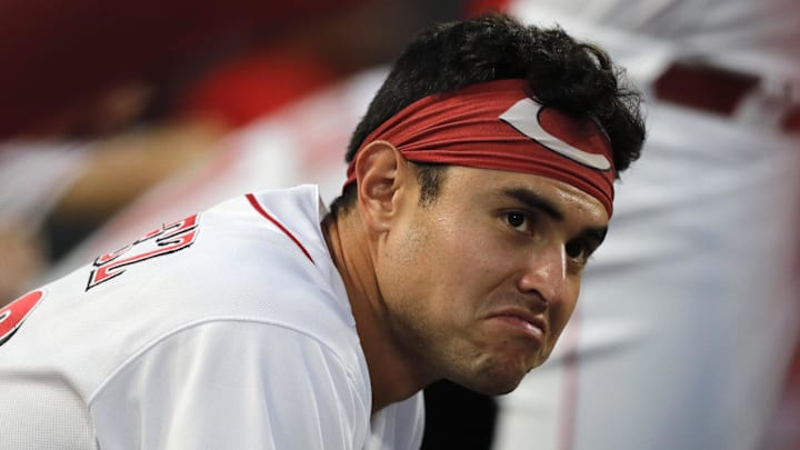 Cincinnati Reds infielder Alejo Lopez watches from the dugout.