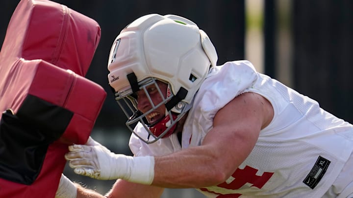 Ohio State Buckeyes defensive end Beau Atkinson (14) hits a tackle sled during football training camp at the Woody Hayes Athletic Center on Aug. 1, 2025.