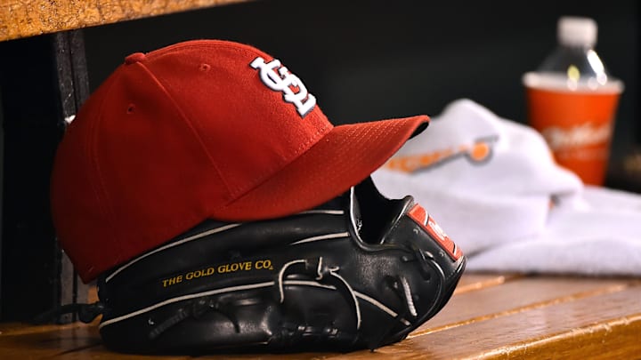 Aug 15, 2015; St. Louis, MO, USA; A detailed view of a baseball glove and St. Louis Cardinals hat in the dugout during the game between the Cardinals and the Miami Marlins at Busch Stadium. Mandatory Credit: Jasen Vinlove-Imagn Images