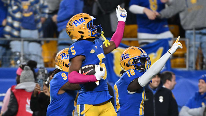 Oct 24, 2024; Pittsburgh, Pennsylvania, USA; Pittsburgh Panthers defensive back Phillip O'Brien Jr. (5) celebrates an interception against the Syracuse Orange during the third quarter at Acrisure Stadium. Mandatory Credit: Barry Reeger-Imagn Images