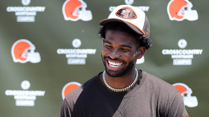 Cleveland Browns quarterback Shedeur Sanders (12) jokes about his signing bonus during a press conference before day two of NFL rookie minicamp at the Cleveland Browns training facility on Saturday, May 10, 2025, in Berea, Ohio.