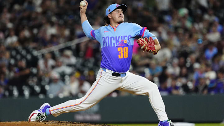 Aug 15, 2025; Denver, Colorado, USA; Colorado Rockies relief pitcher Victor Vodnik (38) delivers a pitch in the ninth inning against the Arizona Diamondbacks at Coors Field. 