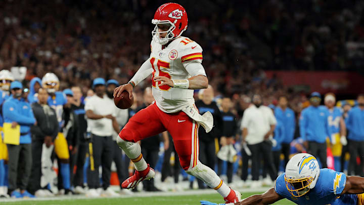 Sep 5, 2025; Sao Paulo, BRAZIL; Kansas City Chiefs quarterback Patrick Mahomes (15) runs against Los Angeles Chargers linebacker Khalil Mack (52) in the second half during a NFL game at Corinthians Arena. Mandatory Credit: Amanda Perobelli/Reuters via Imagn Images