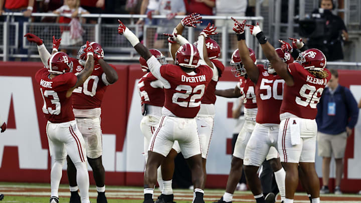 Oct 26, 2024; Tuscaloosa, Alabama, USA;  Alabama Crimson Tide defenders celebrate after a goal line stand against the Missouri Tigers on fourth down to preserve a shut out during the second half at Bryant-Denny Stadium. Mandatory Credit: Butch Dill-Imagn Images