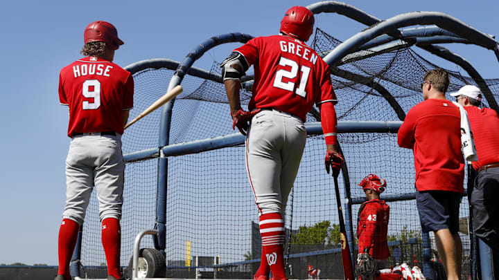 Feb 20, 2023; West Palm Beach, FL, USA; Washington Nationals outfielder Elijah Green (21) and infielder Brady House (9) attend batting practice during a spring training workout at The Ballpark of the Palm Beaches. Feb 20, 2023; West Palm Beach, FL, USA; Washington Nationals outfielder Elijah Green (21) and infielder Brady House (9) attend batting practice during a spring training workout at The Ballpark of the Palm Beaches.