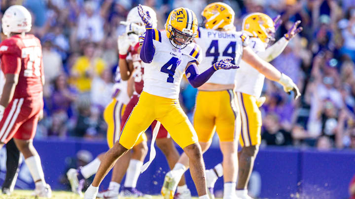 Nov 15, 2025; Baton Rouge, Louisiana, USA; LSU Tigers cornerback Mansoor Delane (4) reacts to a stop on fourth down against the Arkansas Razorbacks during the second half at Tiger Stadium. Mandatory Credit: Stephen Lew-Imagn Images Nov 15, 2025; Baton Rouge, Louisiana, USA; LSU Tigers cornerback Mansoor Delane (4) reacts to a stop on fourth down against the Arkansas Razorbacks during the second half at Tiger Stadium. Mandatory Credit: Stephen Lew-Imagn Images