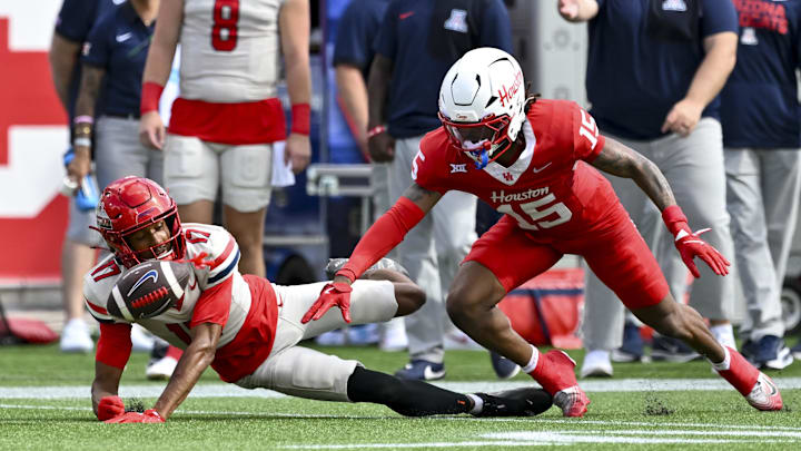Oct 18, 2025; Houston, Texas, USA; Houston Cougars defensive back Will James (15) breaks up a pass intended for Arizona Wildcats wide receiver Isaiah Mizell (17) during the first half at TDECU Stadium. Mandatory Credit: Maria Lysaker-Imagn Images Oct 18, 2025; Houston, Texas, USA; Houston Cougars defensive back Will James (15) breaks up a pass intended for Arizona Wildcats wide receiver Isaiah Mizell (17) during the first half at TDECU Stadium. Mandatory Credit: Maria Lysaker-Imagn Images