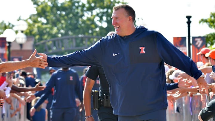Aug 29, 2025; Champaign, Illinois, USA;  Illinois Fighting Illini head coach Bret Bielema leads his team during the Illini Walk before an NCAA football game against the Western Illinois Leathernecks at Memorial Stadium. Mandatory Credit: Ron Johnson-Imagn Images