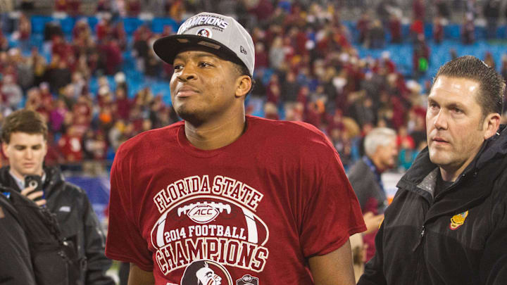 Dec 6, 2014; Charlotte, NC, USA; Florida State Seminoles quarterback Jameis Winston (5) walks off the field after defeating the Georgia Tech Yellow Jackets at Bank of America Stadium. FSU defeated Georgia Tech 37-35. Mandatory Credit: Jeremy Brevard-Imagn Images