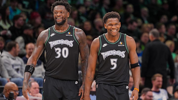 Feb 9, 2026; Minneapolis, Minnesota, USA; Minnesota Timberwolves forward Julius Randle (30) and guard Anthony Edwards (5) laugh after a timeout against the Atlanta Hawks in the fourth quarter at Target Center. Mandatory Credit: Brad Rempel-Imagn Images