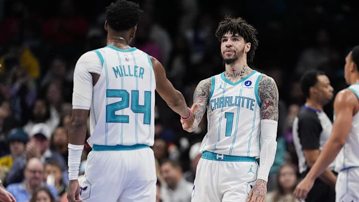 Charlotte Hornets guard LaMelo Ball (1) and forward Brandon Miller (24) high five 