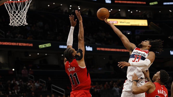 Oct 12, 2025; Washington, District of Columbia, USA; Washington Wizards forward Dillon Jones (33) shoots the ball as Toronto Raptors center Olivier Sarr (11) defends in the second half at Capital One Arena. Mandatory Credit: Geoff Burke-Imagn Images Oct 12, 2025; Washington, District of Columbia, USA; Washington Wizards forward Dillon Jones (33) shoots the ball as Toronto Raptors center Olivier Sarr (11) defends in the second half at Capital One Arena. Mandatory Credit: Geoff Burke-Imagn Images