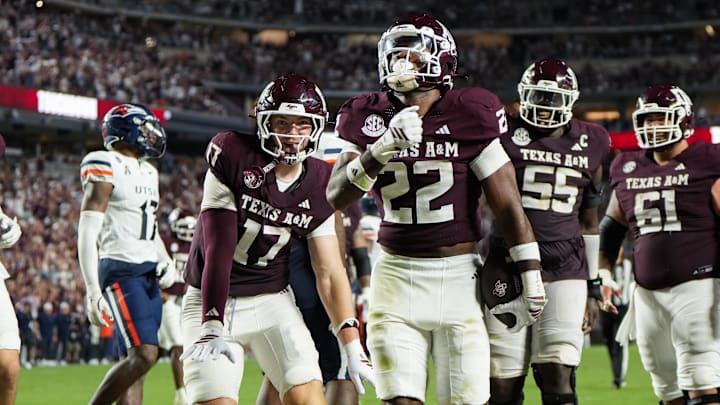 Aug 30, 2025; College Station, Texas, USA; Texas A&M Aggies tight end Theo Melin Ohrstrom (17) and Texas A&M Aggies running back EJ Smith (22) celebrate a touchdown during the second half against the UTSA Roadrunners at Kyle Field. Mandatory Credit: Sean Thomas-Imagn Images