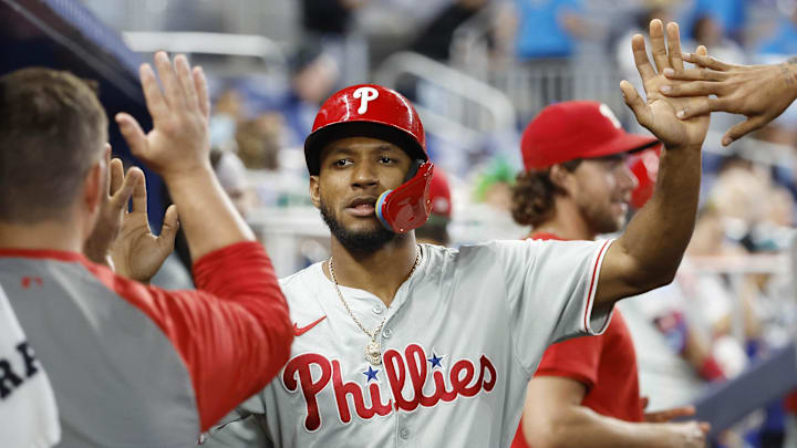 Sep 8, 2024; Miami, Florida, USA; Philadelphia Phillies center fielder Johan Rojas (18) celebrates in the dugout after scoring against the Miami Marlins in the ninth inning at loanDepot Park. Sep 8, 2024; Miami, Florida, USA; Philadelphia Phillies center fielder Johan Rojas (18) celebrates in the dugout after scoring against the Miami Marlins in the ninth inning at loanDepot Park.