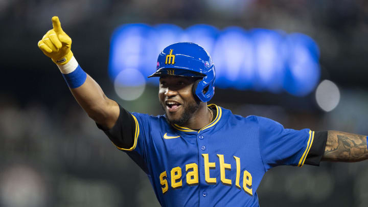 Jun 14, 2024; Seattle, Washington, USA; Seattle Mariners left fielder Victor Robles (10) celebrates after hitting a bunt single during the fourth inning against the Texas Rangers at T-Mobile Park. Mandatory Credit: Stephen Brashear-USA TODAY Sports Jun 14, 2024; Seattle, Washington, USA; Seattle Mariners left fielder Victor Robles (10) celebrates after hitting a bunt single during the fourth inning against the Texas Rangers at T-Mobile Park. Mandatory Credit: Stephen Brashear-USA TODAY Sports
