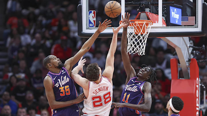 Feb 23, 2024; Houston, Texas, USA; Phoenix Suns forward Kevin Durant (35) and center Bol Bol (11) defend against Houston Rockets center Alperen Sengun (28) during the fourth quarter at Toyota Center. Mandatory Credit: Troy Taormina-Imagn Images