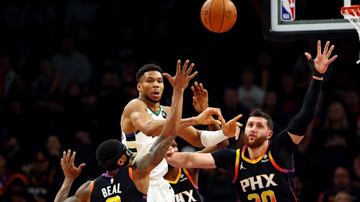 Feb 6, 2024; Phoenix, Arizona, USA; Milwaukee Bucks forward Giannis Antetokounmpo (34) passes the ball against Phoenix Suns guard Bradley Beal (3) and center Jusuf Nurkic (20) during the third quarter at Footprint Center. Mandatory Credit: Mark J. Rebilas-Imagn Images Feb 6, 2024; Phoenix, Arizona, USA; Milwaukee Bucks forward Giannis Antetokounmpo (34) passes the ball against Phoenix Suns guard Bradley Beal (3) and center Jusuf Nurkic (20) during the third quarter at Footprint Center. Mandatory Credit: Mark J. Rebilas-Imagn Images