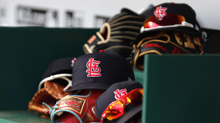 Apr 24, 2022; Cincinnati, Ohio, USA; A view of St. Louis Cardinals players hats and gloves in the dugout during a game with the Cincinnati Reds at Great American Ball Park. Mandatory Credit: David Kohl-Imagn Images Apr 24, 2022; Cincinnati, Ohio, USA; A view of St. Louis Cardinals players hats and gloves in the dugout during a game with the Cincinnati Reds at Great American Ball Park. Mandatory Credit: David Kohl-Imagn Images