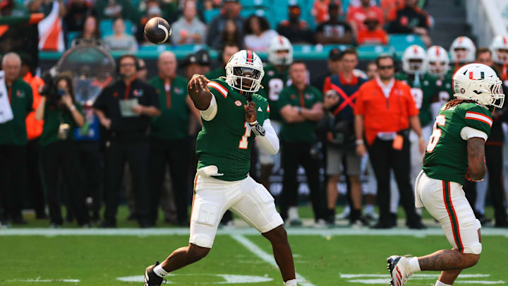 Nov 23, 2024; Miami Gardens, Florida, USA; Miami Hurricanes quarterback Cam Ward (1) throws the football against the Wake Forest Demon Deacons during the first quarter at Hard Rock Stadium. Mandatory Credit: Sam Navarro-Imagn Images