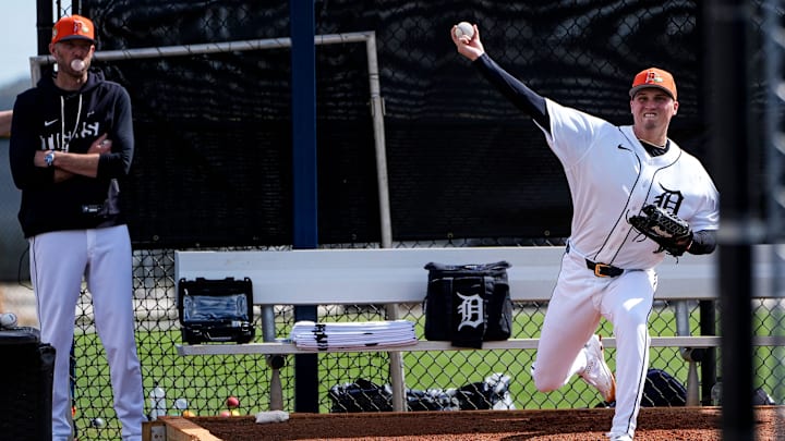 Detroit Tigers pitcher Ty Madden practices as pitching coach Chris Fetter watches during spring training at TigerTown in Lakeland, Fla. on Thursday, Feb. 19, 2026.