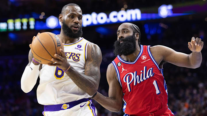 Dec 9, 2022; Philadelphia, Pennsylvania, USA; Los Angeles Lakers forward LeBron James (6) controls the ball against Philadelphia 76ers guard James Harden (1) during the fourth quarter at Wells Fargo Center. Mandatory Credit: Bill Streicher-Imagn Images