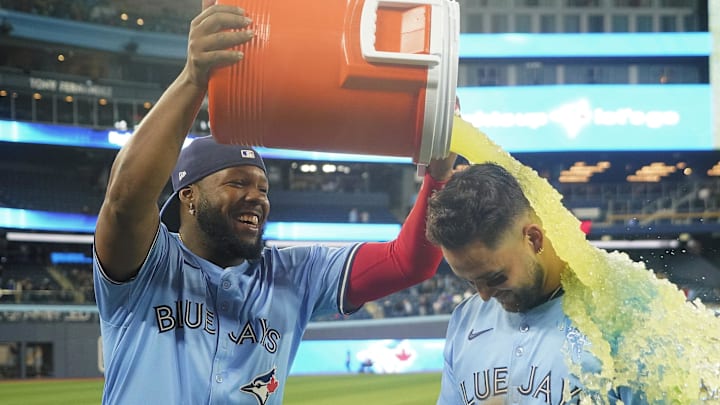 Apr 1, 2025; Toronto, Ontario, CAN; Toronto Blue Jays first baseman Vladimir Guerrero (27) douses shortstop Bo Bichette (11) with Gatorade following a win over the Washington Nationals at Rogers Centre. Mandatory Credit: John E. Sokolowski-Imagn Images Apr 1, 2025; Toronto, Ontario, CAN; Toronto Blue Jays first baseman Vladimir Guerrero (27) douses shortstop Bo Bichette (11) with Gatorade following a win over the Washington Nationals at Rogers Centre. Mandatory Credit: John E. Sokolowski-Imagn Images