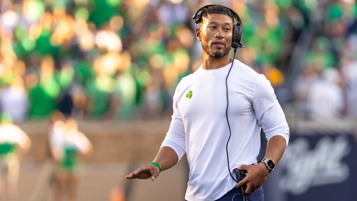 Oct 4, 2025; South Bend, Indiana, USA; Notre Dame head football coach Marcus Freeman adjusts his radio against the Boise State Broncos at Notre Dame Stadium. Mandatory Credit: Michael Caterina-Imagn Images Oct 4, 2025; South Bend, Indiana, USA; Notre Dame head football coach Marcus Freeman adjusts his radio against the Boise State Broncos at Notre Dame Stadium. Mandatory Credit: Michael Caterina-Imagn Images